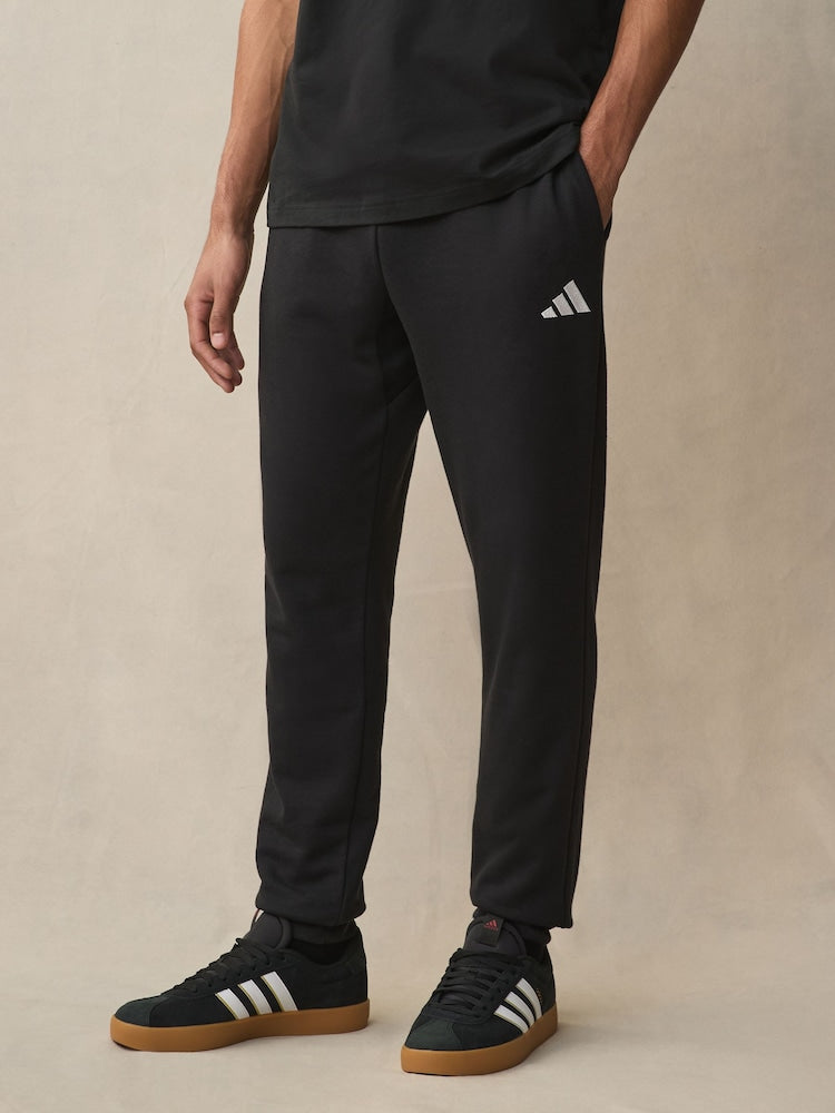 Adidas Men's black essentials jersey joggers